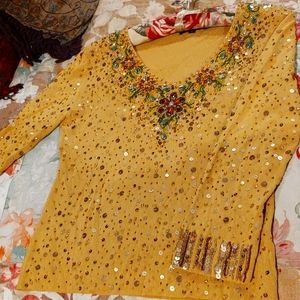 Pierre mustard color heavy beaded/sequined top. Long sleeves, plain back. Size L
